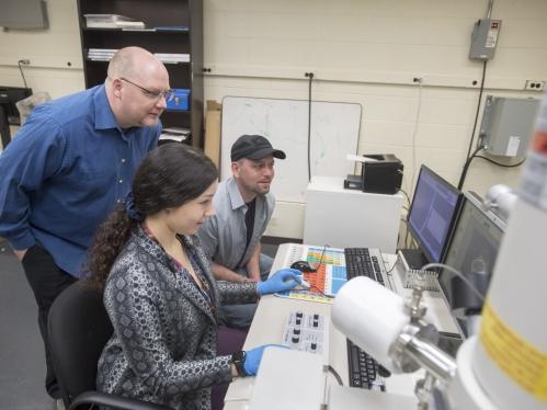 researchers in a lab at computer